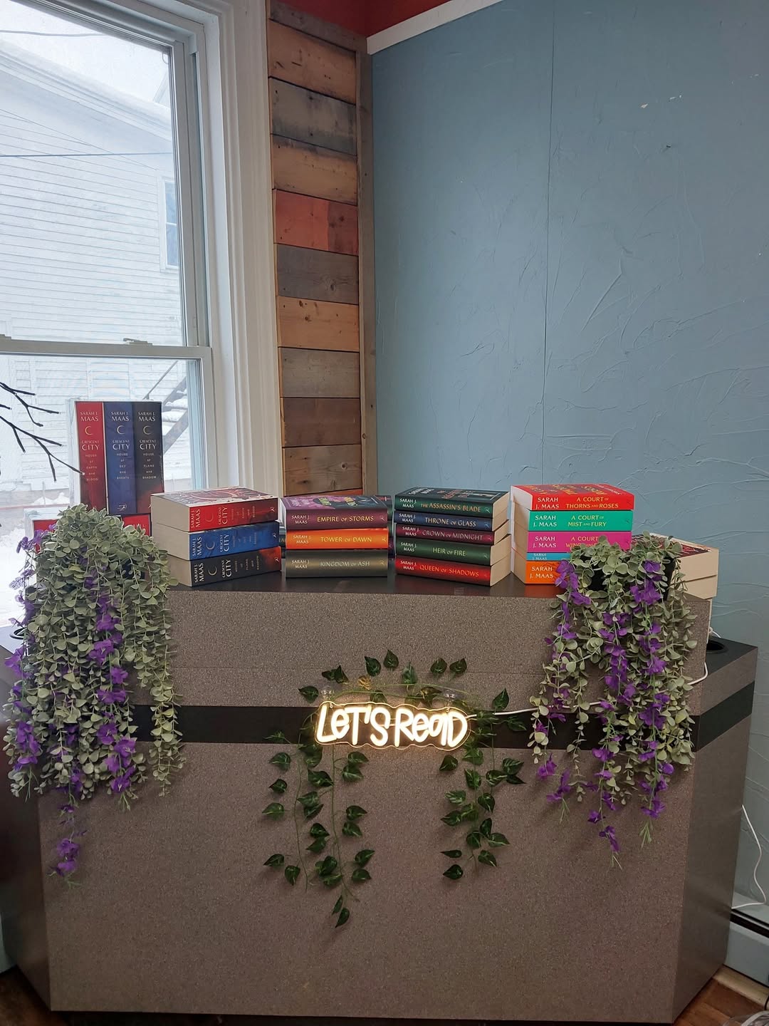 Book display with neon sign
