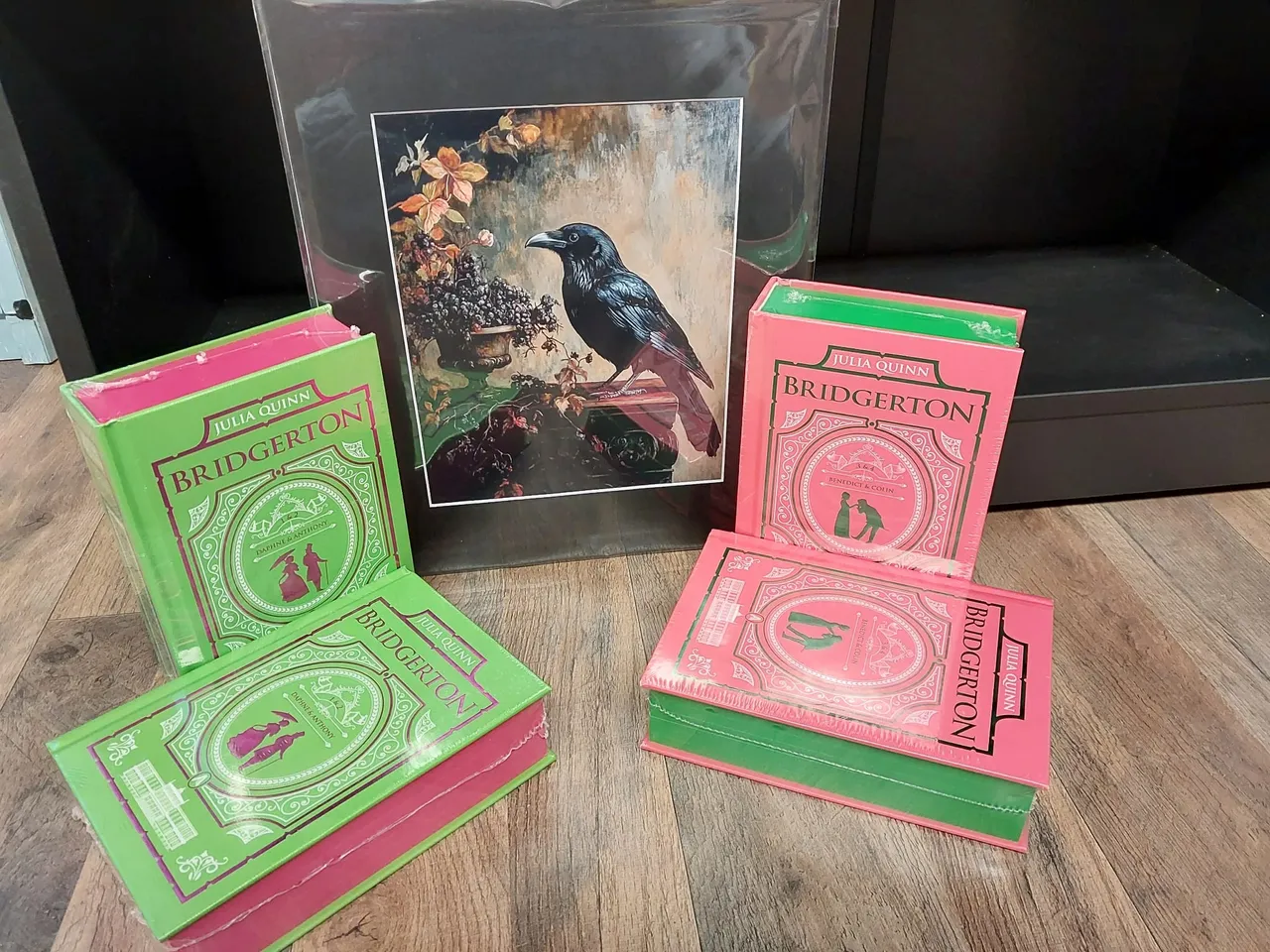 Bridgerton books and raven artwork